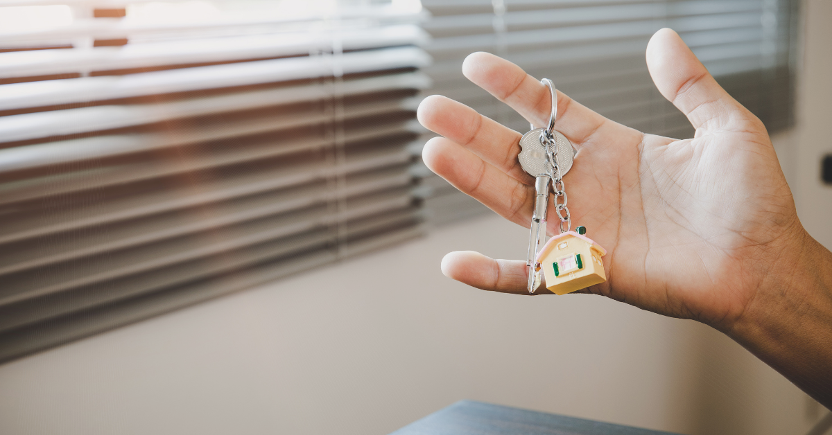 First-time homebuyer holding house keys in Central Florida